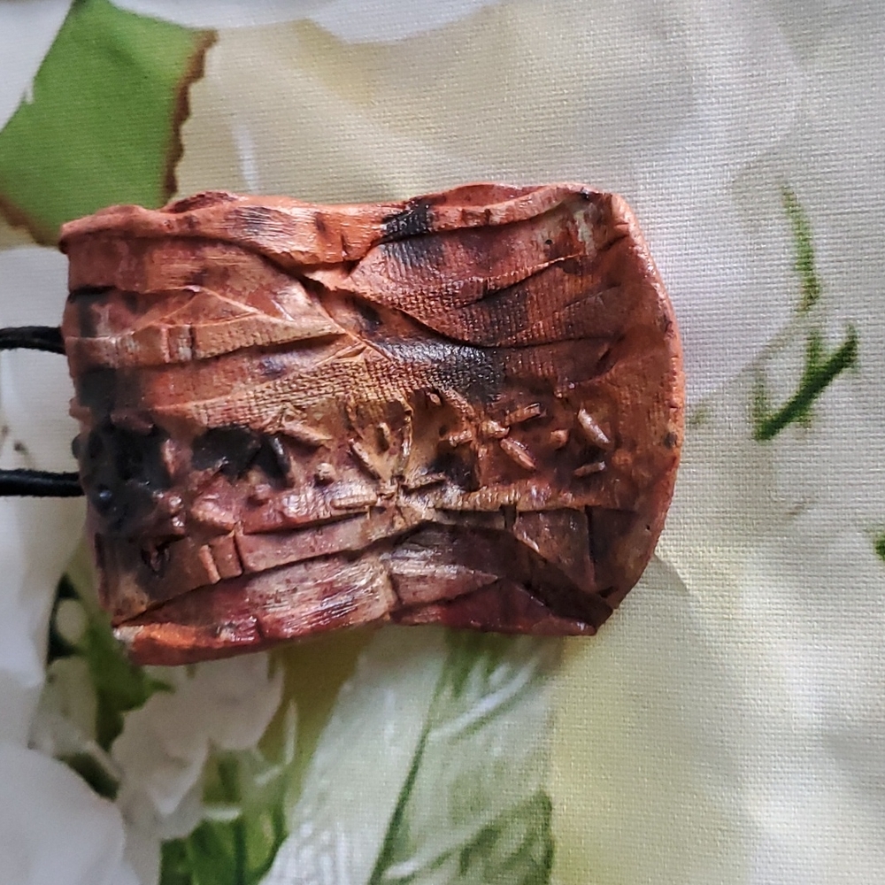 Handmade Clay Necklace on a Black Leather Cord with brass findings. 25"